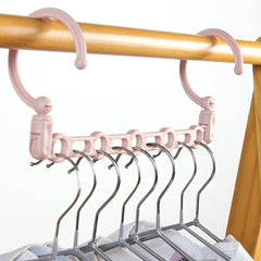 Multifunctional rotating portable clothes hanger