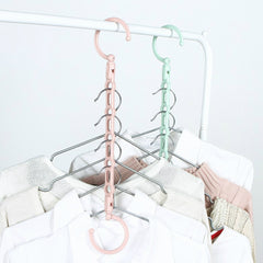 Multifunctional rotating portable clothes hanger