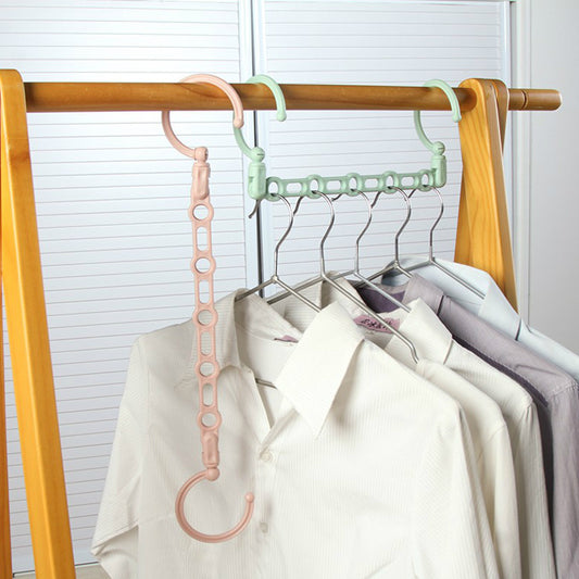 Multifunctional rotating portable clothes hanger