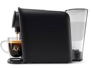 barista side angle showing detachable water tank and coffee cup for scale